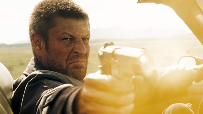 Sean Bean shoots a gun while driving