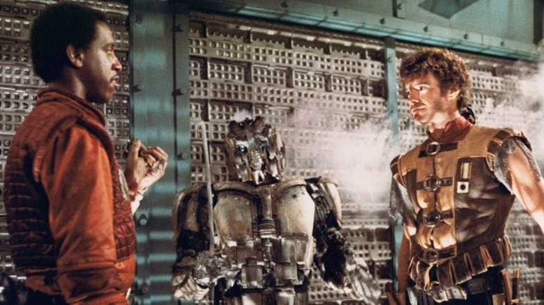 Jason and Roscoe stand next to robot