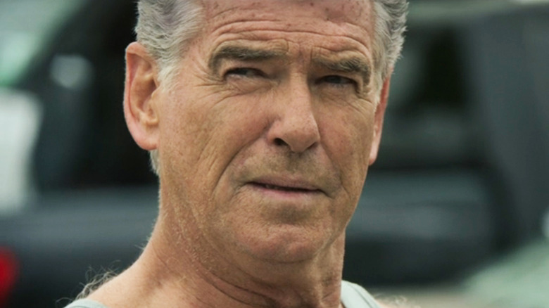 Pierce Brosnan's Charlie Swift looks off to his right in closeup in Fast Charlie