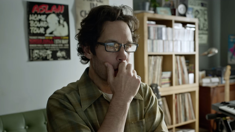 Rick Power looking alarmed while wearing glasses in Power Ballad