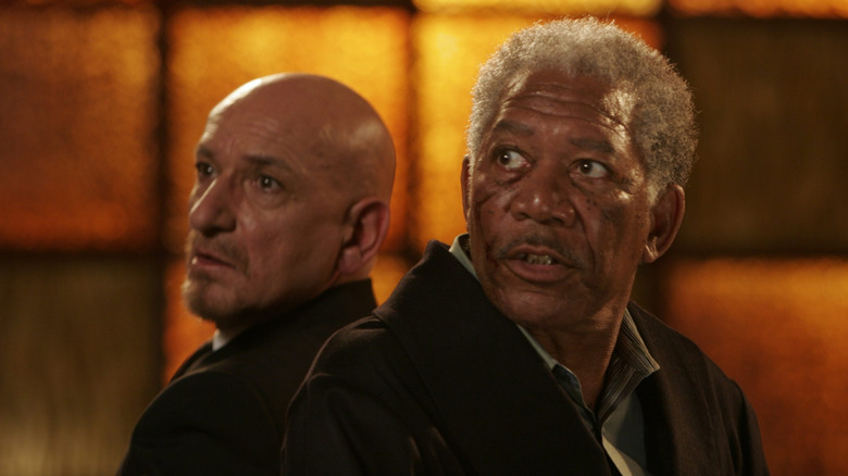 Ben Kingsley as The Rabbi and Morgan Freeman as The Boss tied to chairs back to back and looking terrified in Lucky Number Slevin
