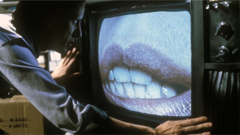 Max Renn interacts with his TV in Videodrome.