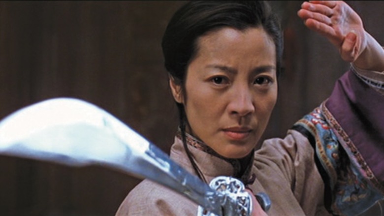 Michelle Yeoh wields a sword as Yu Shu Lien in Crouching Tiger, Hidden Dragon