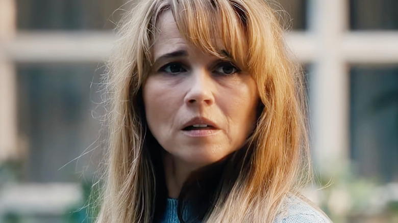 Linda Cardellini as Pamela Voorhees looking distressed in Crystal Lake