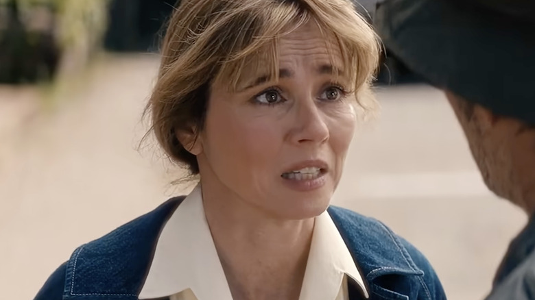 Linda Cardellini as Pamela Voorhees looking distressed in Crystal Lake