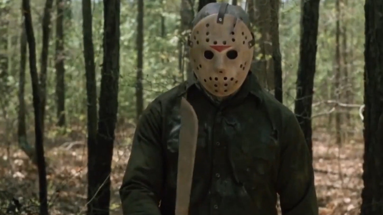 Jason Voorhees holding his machete in the woods in Friday the 13th Part VI: Jason Lives