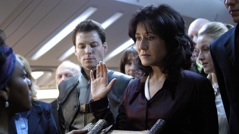 Mary McDonnell as Laura Roslin taking an oath in Battlestar Galactica (2003)