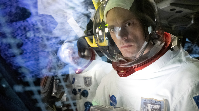 Joel Kinnaman wearing astronaut suit