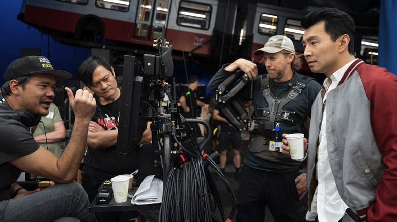 Destin Daniel Cretton and Simu Liu on the set of Shang-Chi