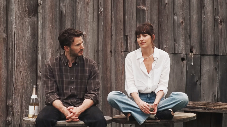 Dakota Johnson's Lucy Mason sits alongside Chris Evans' John Pitts in Materialists