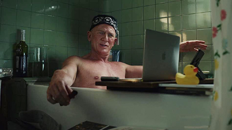 Benoit in the bathtub in Glass Onion: A Knives Out Mystery