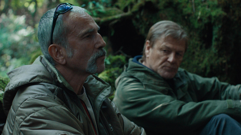 Daniel Day Lewis as Ray leaning up against a log talking to Sean Bean as Jem in Anemone