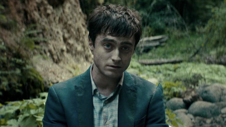 Daniel Radcliffe sitting in the forest