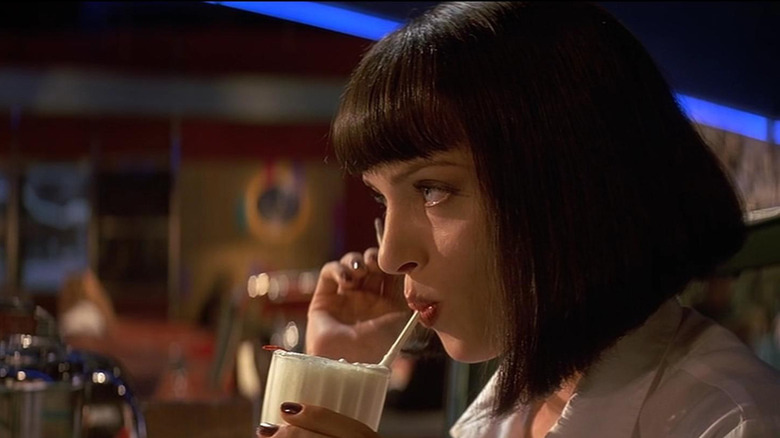 Mia Wallace in Pulp Fiction sipping a milkshake