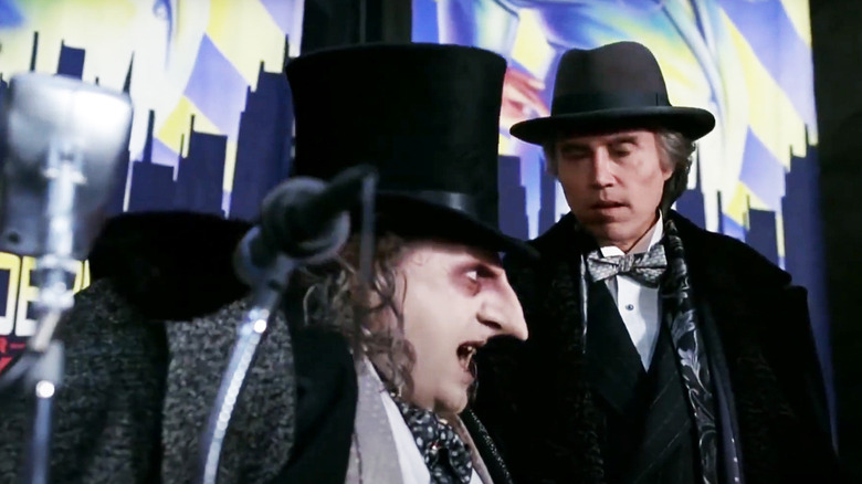 Danny DeVito's Penguin talks to Christopher Walken's Max Shreck on-stage in Batman Returns