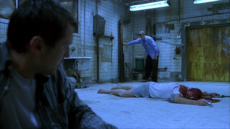 Leigh Whannell, Tobin Bell, and Cary Elwes in Saw