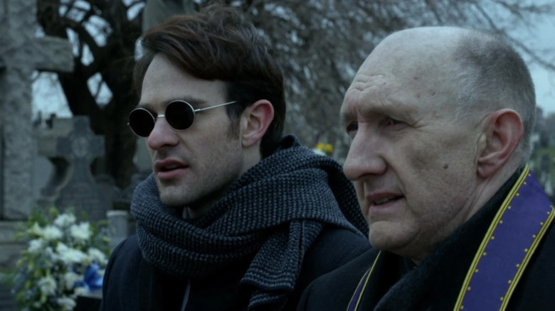 Daredevil season 1 finale: Matt Murdock and Father Paul Lantom standing together at funeral
