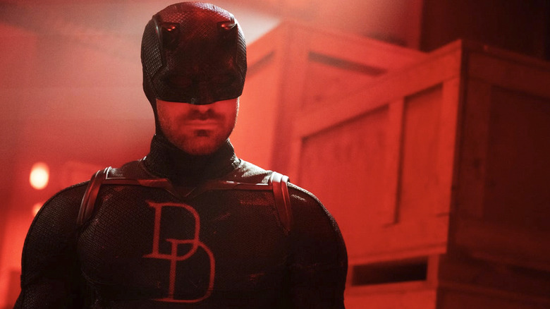 Daredevil (Charlie Cox) standing in a red room in Daredevil: Born Again season 2