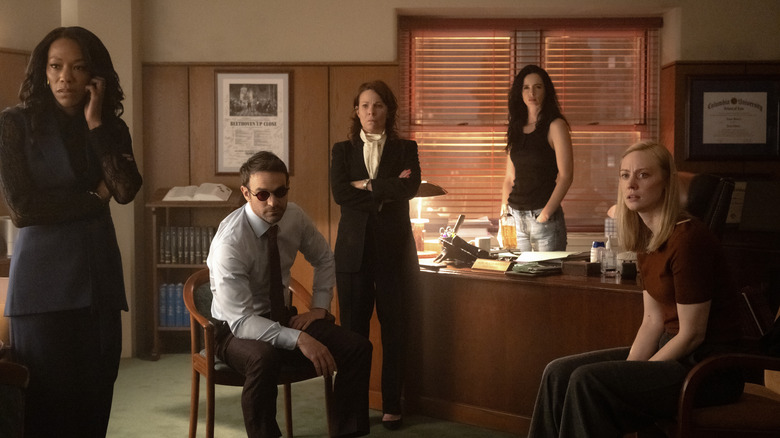 Kirsten McDuffie (Nikki M. James), Matt Murdock/Daredevil (Charlie Cox) , Governor Marge McCaffery (Lili Taylor), Jessica Jones (Krysten Ritter) and Karen Page (Deborah Ann Woll) sitting in an office in Daredevil: Born Again