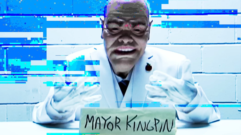 An unknown figure wearing a mask and dressed like Vincent D'Onofrio as Wilson Fisk in a video shown in Daredevil: Born Again