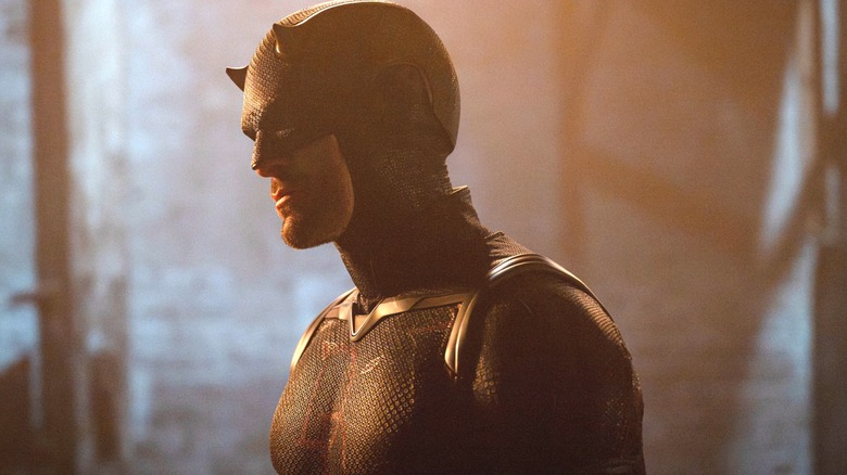Charlie Cox as Matt Murdock wearing his Daredevil outfit and looking off to the side in Daredevil: Born Again season 2