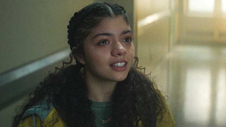 Camila Rodriguez as Angela Del Toro holding back tears while talking to Charlie Cox's Matt Murdock in Daredevil: Born Again