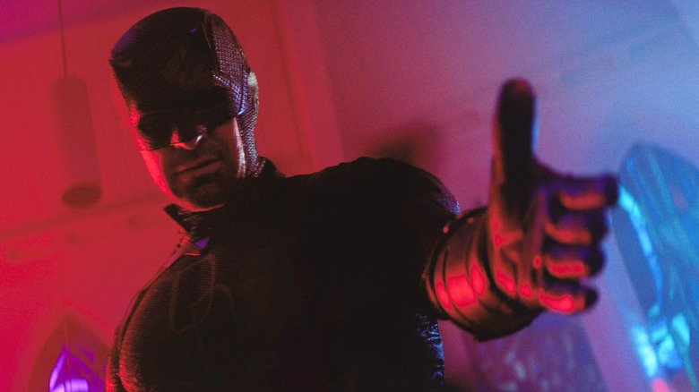 Charlie Cox as Daredevil extending out his hand in Daredevil: Born Again season 2