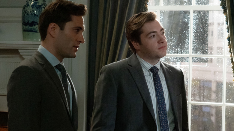 Arty Froushan as Buck Cashman standing next to Michael Gandolfini as Daniel Blake in an office in Daredevil: Born Again