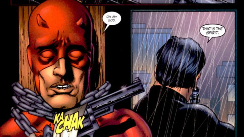 Daredevil pulls the trigger on a gun pointed at The Punisher