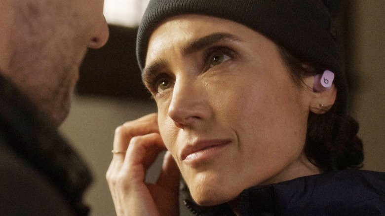 Jennifer Connelly as Daniela Dessen smiling while wearing a cap in Dark Matter