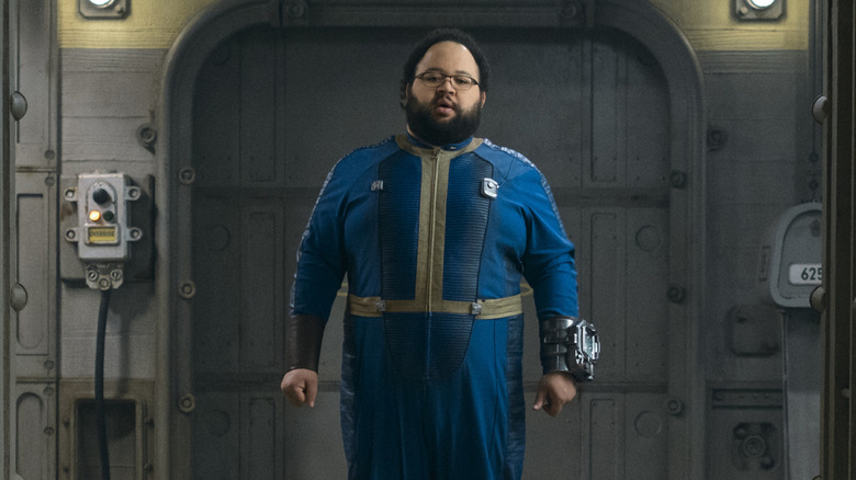 Zach Cherry as Woody Thomas in a bunker in Fallout