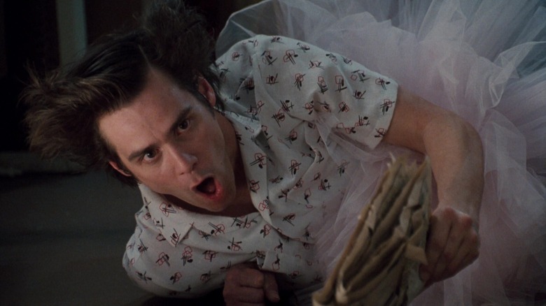 Jim Carrey's Ace Ventura lies on the floor in a tutu in Ace Ventura Pet Detective.jpg.jpg