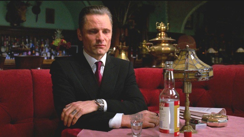 Nikolai looks somber while sitting inside the Trans-Siberian restaurant in Eastern Promises