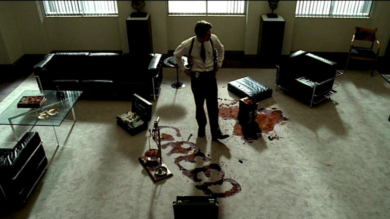 Mills surveys a murder scene in Seven