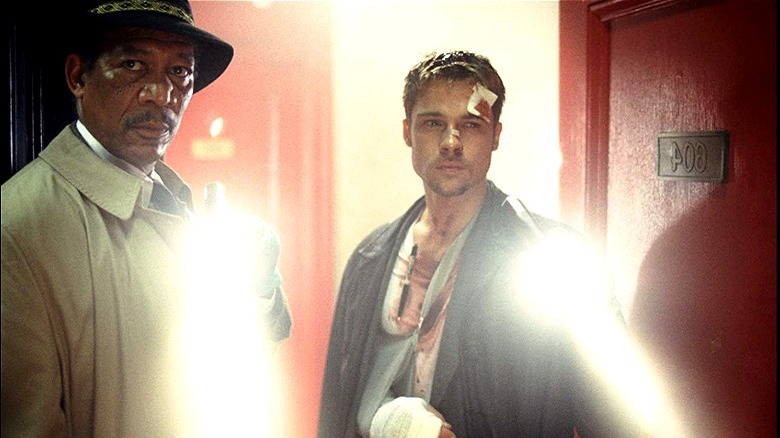 Mills and Somerset enter a victim's apartment.