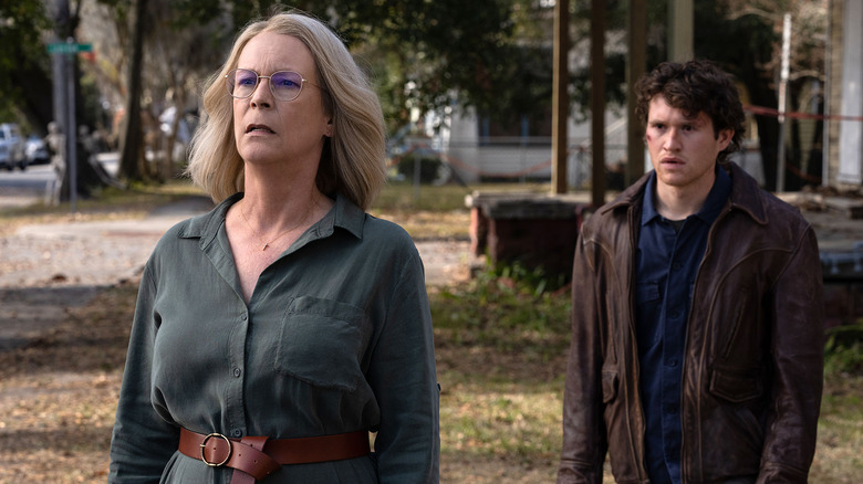 Corey standing behind Laurie