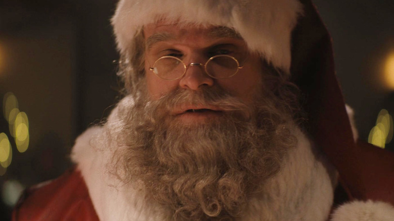 David Harbour as Santa Claus wearing glasses in Violent Night