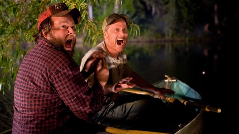 Tyler Labine's Dale and Alan Tudyk's Tucker yelling in a canoe in Tucker and Dale vs. Evil