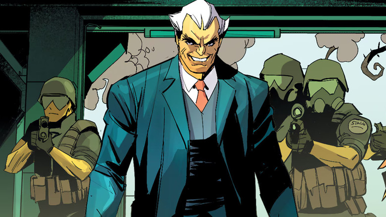 Simon Stagg enters a building with private mercenaries