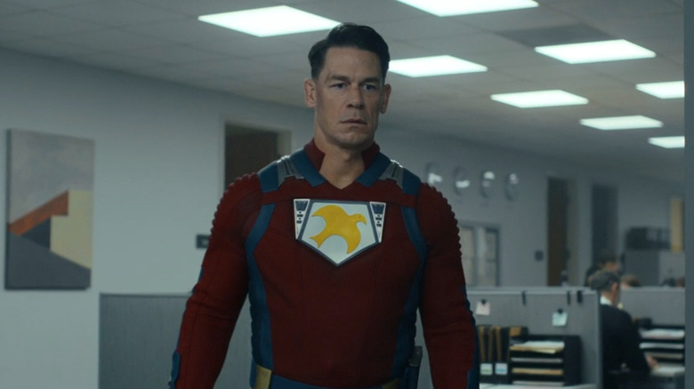 Peacemaker looking confused by the Earth-X flag in Peacemaker