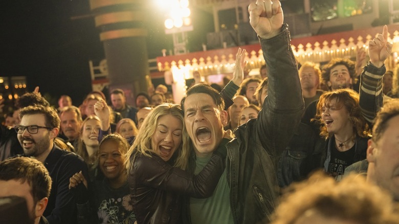 Chris and Harcourt scream in joy at a rock concert in Peacemaker