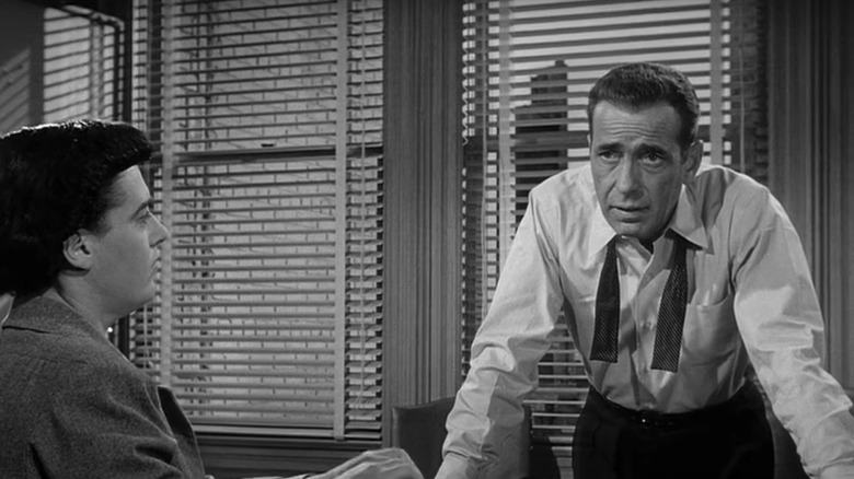 Humphrey Bogart Deadline USA exhausted desk secretary