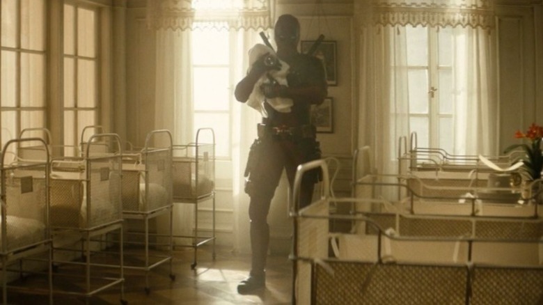 Wade looks at a baby in Deadpool 2