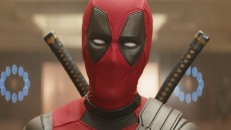 Ryan Reynolds as Deadpool standing in the TVA timeline observation room in Deadpool & Wolverine