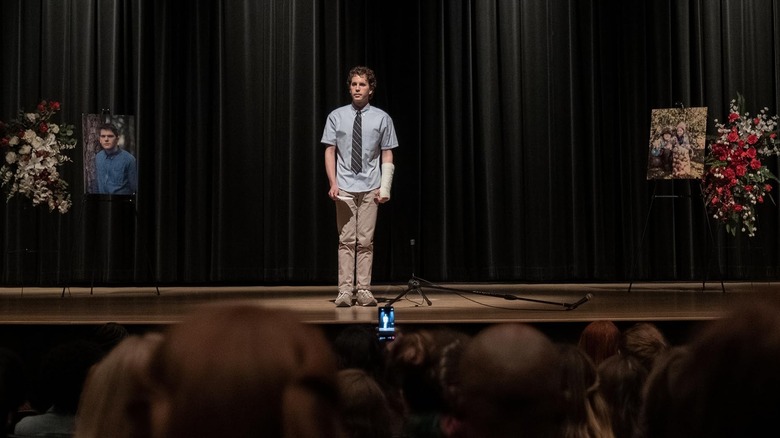 Ben Platt as Evan Hansen standing alone on a stage in Dear Evan Hansen