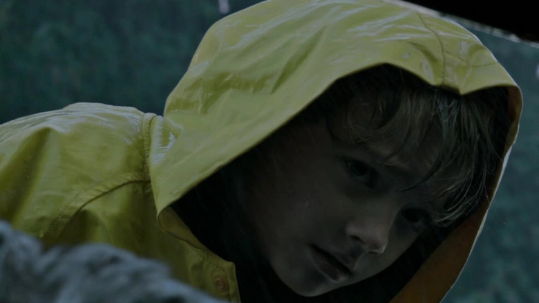Georgie looking in sewer