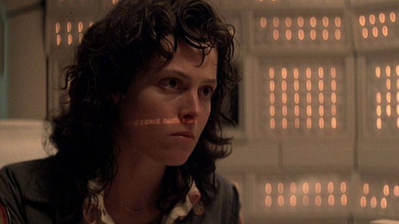 Alien Ripley stares at a display