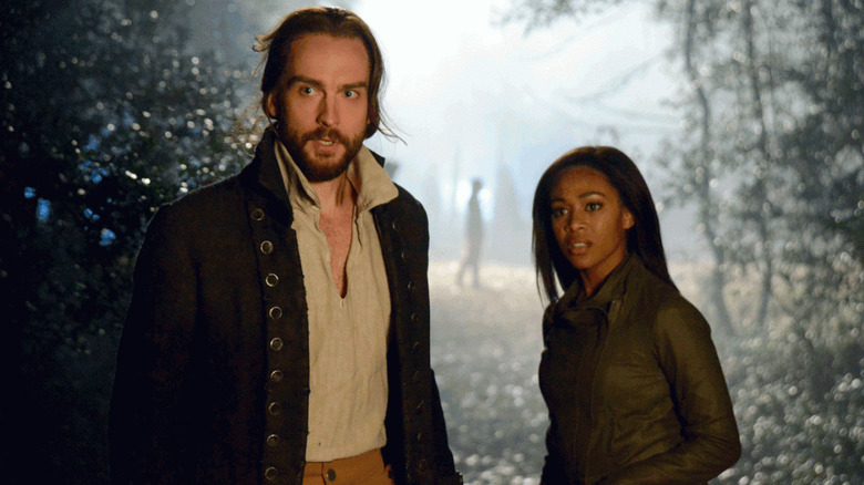 Ichabod Crane (Tom Mison) and Abbie Mills (Nicole Beharie) navigate a spooky town in the Sleepy Hollow series.