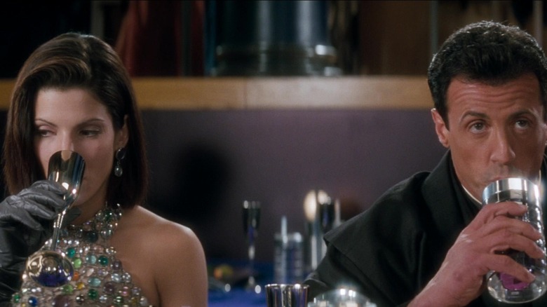 Sandra Bullock and Sylvester Stallone in Demolition Man