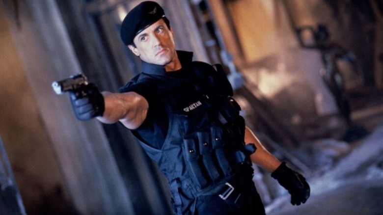 Sylvester Stallone pointing gun Demolition Man